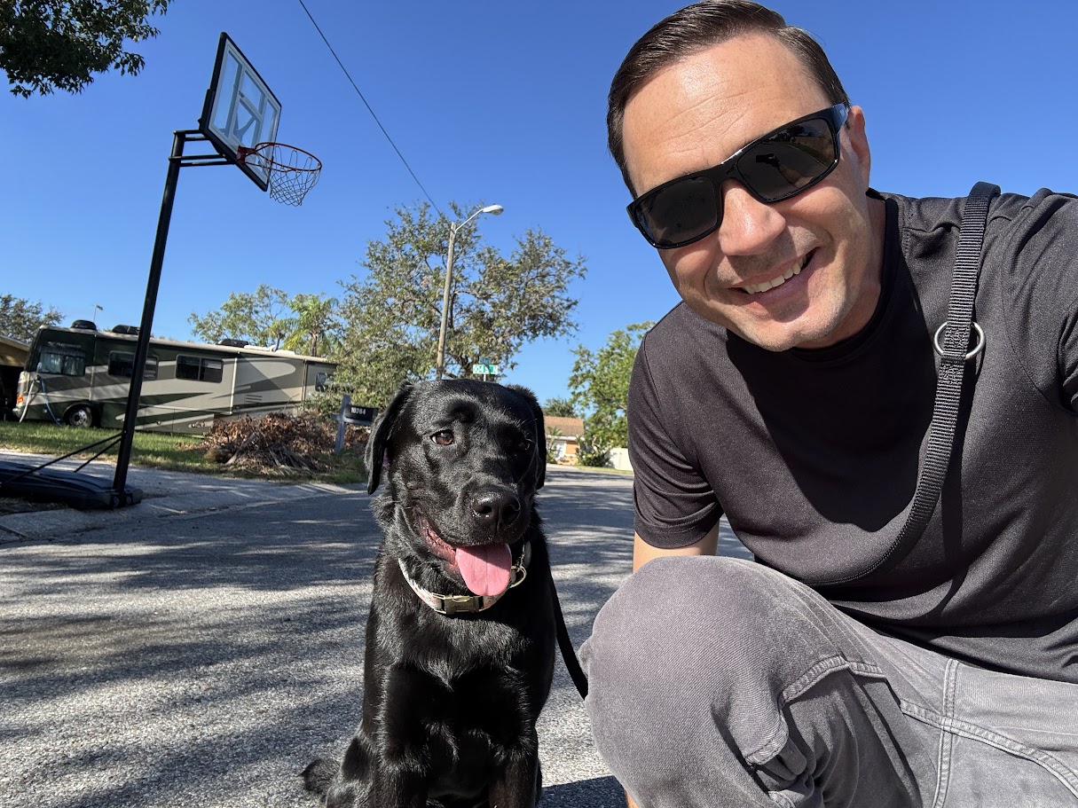 Black Lab Deals founder with Olive the black lab